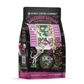 The front of a 12 ounce bag of Bones Coffee Company Blackberry Cobbler coffee. Its flavor is blackberry cobbler, and it has a skeleton dog and grandma with a blackberry cobbler on a windowsill on the art.